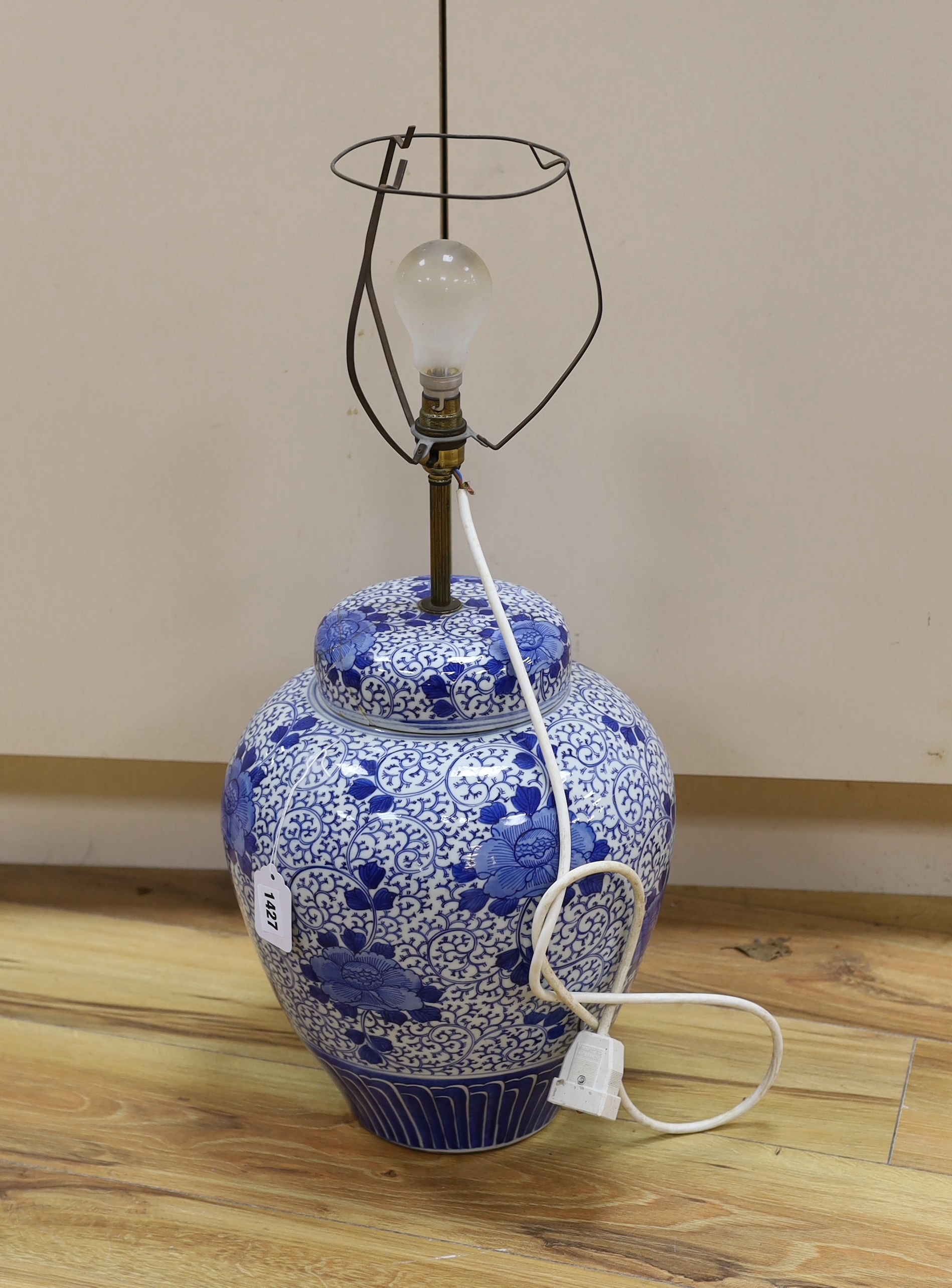 A Chinese blue and white jar and cover (converted to a desk lamp) (A/F), jar and cover 38 cm high